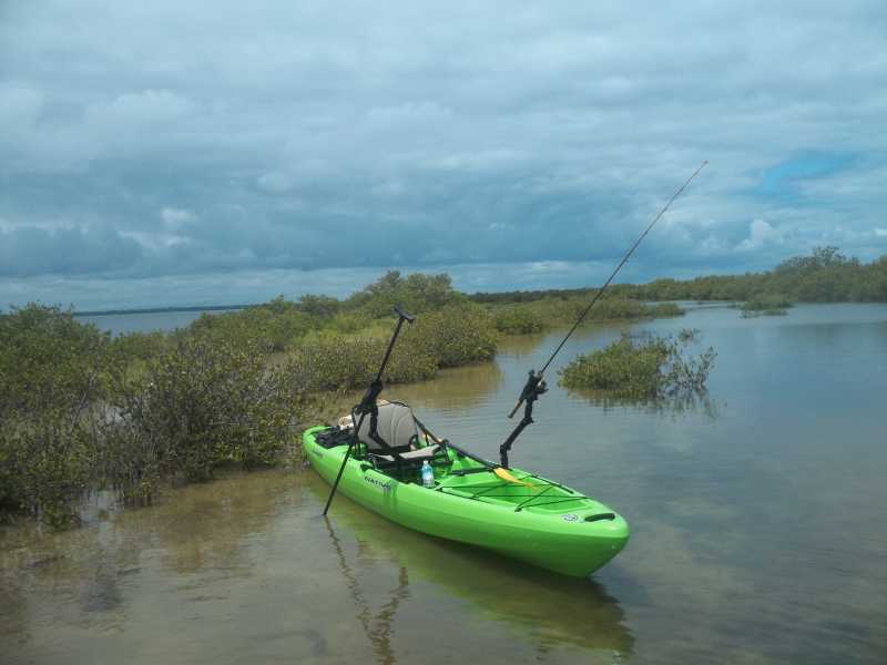 Native Watercraft Slayer Propel 13 fishing kayak in action with rods!