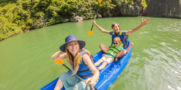 a family enjoying their sit-on-kayak