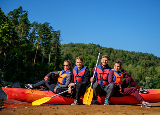 a group of kayakers in one big kayak